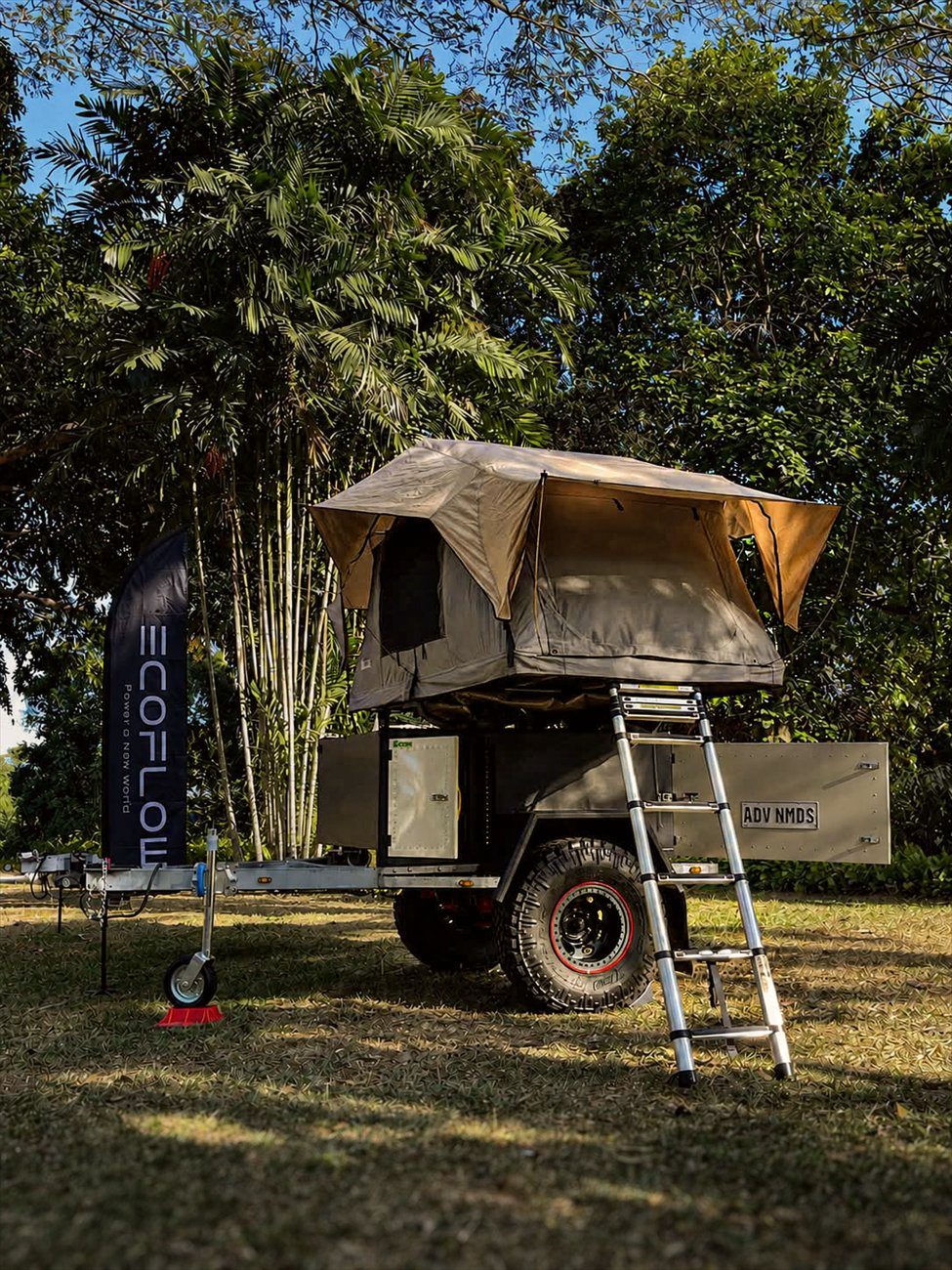Iron Wolf ADV NMDS camper with rooftop tent deployed